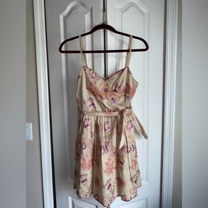 Chelsea & Violet Cream multi colored Pleated Wrap Mini Dress is a women’…